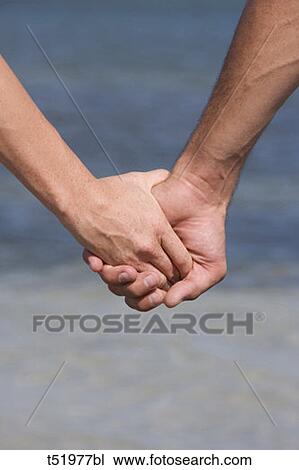 Couple holding hands View Large Photo Image Stock Image - Couple holding hands . Fotosearch