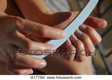 Filing nails View Large Photo Image Stock Image - Filing nails . Fotosearch