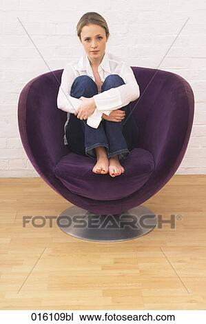 full body portrait of young woman sitting in purple arm chair View Large Photo Image Stock Image - full body portrait of young woman sitting in purple arm chair. Fotosearch