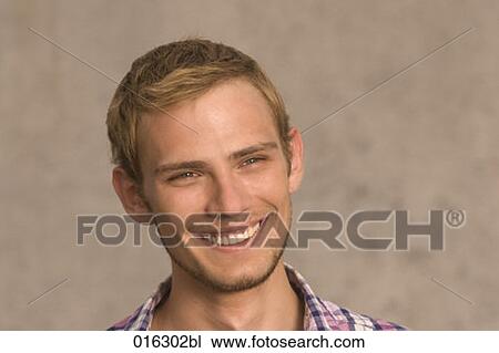 Stock Image - headshot of smiling young man. Fotosearch