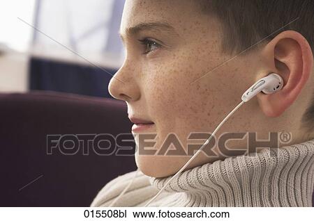 headshot of young boy with earphones View Large Photo Image Stock Image - headshot of young boy with earphones. Fotosearch