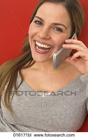headshot of young woman with mobile phone View Large Photo Image Stock Image - headshot of young woman with mobile phone. Fotosearch