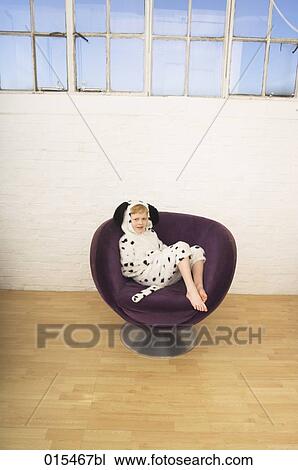 high angle view of little boy in dalmatian dog costume sitting in purple arm chair View Large Photo Image Stock Image - high angle view of little boy in dalmatian dog costume sitting in purple arm chair. Fotosearch