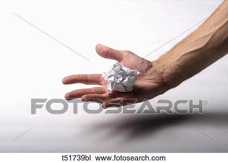 Stock Image - Holding crumpled paper . Fotosearch