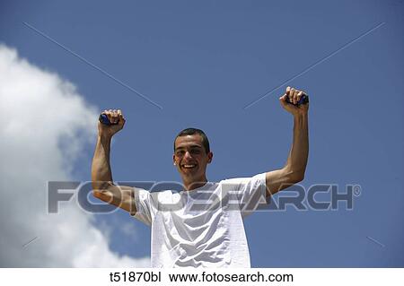 Man exercising outdoors View Large Photo Image Stock Image - Man exercising outdoors . Fotosearch