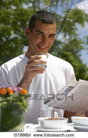 Man having breakfast outdoors View Large Photo Image Stock Image - Man having breakfast outdoors . Fotosearch