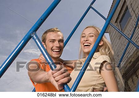 portrait of happy young couple on stairs View Large Photo Image Stock Image - portrait of happy young couple on stairs. Fotosearch