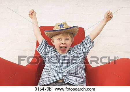 portrait of joyous little boy wearing cowboy hat View Large Photo Image Stock Image - portrait of joyous little boy wearing cowboy hat. Fotosearch