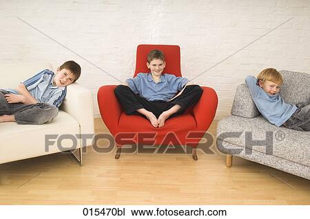 portrait of three brothers sitting in different chairs View Large Photo Image Stock Image - portrait of three brothers sitting in different chairs. Fotosearch