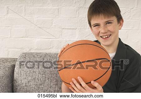 portrait of young boy holding basketball View Large Photo Image Stock Image - portrait of young boy holding basketball. Fotosearch