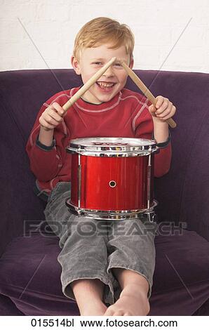 portrait of young boy playing on drum View Large Photo Image Stock Image - portrait of young boy playing on drum. Fotosearch