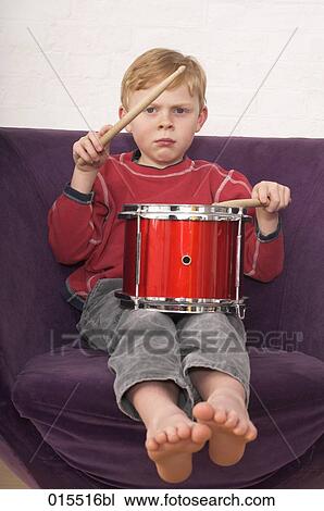 portrait of young boy playing on drum View Large Photo Image Stock Image - portrait of young boy playing on drum. Fotosearch