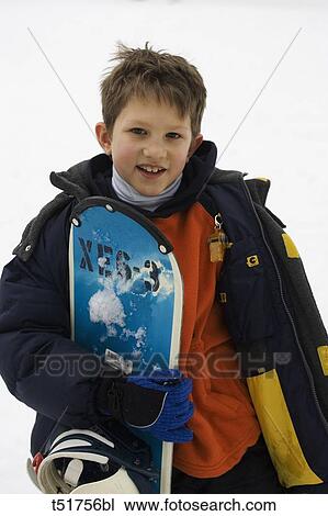 Portrait of young boy snowboarder View Large Photo Image Stock Image - Portrait of young boy snowboarder . Fotosearch