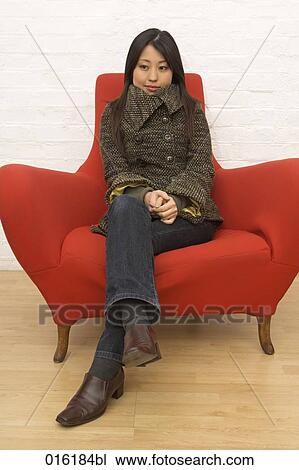portrait of young japanese woman sitting in red arm chair View Large Photo Image Stock Image - portrait of young japanese woman sitting in red arm chair. Fotosearch