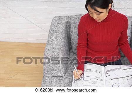 portrait of young japanese woman marking classified ads in newspaper View Large Photo Image Stock Image - portrait of young japanese woman marking classified ads in newspaper. Fotosearch