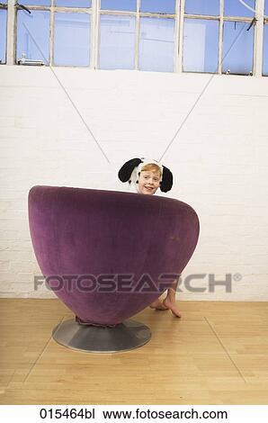 rear view of smiling boy disguised as dalmatian dog sitting in purple arm chair View Large Photo Image Stock Image - rear view of smiling boy disguised as dalmatian dog sitting in purple arm chair. Fotosearch