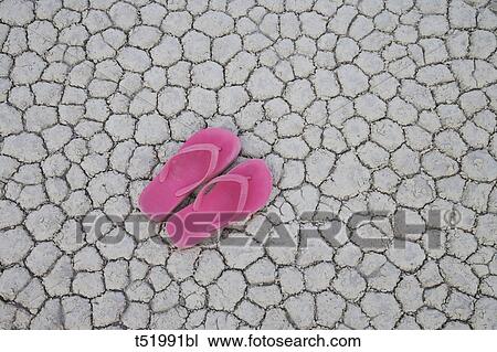Slippers on dried land View Large Photo Image Stock Image - Slippers on dried land . Fotosearch