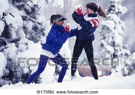 Snow ball fight View Large Photo Image Stock Image - Snow ball fight . Fotosearch