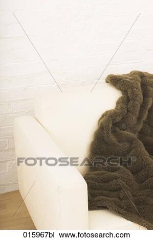 still life brown blanket on white arm chair View Large Photo Image Stock Image - still life brown blanket on white arm chair. Fotosearch