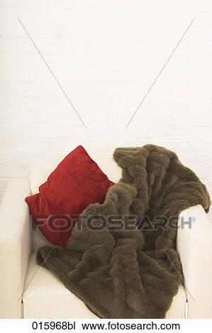 still life brown blanket on white arm chair View Large Photo Image Stock Image - still life brown blanket on white arm chair. Fotosearch