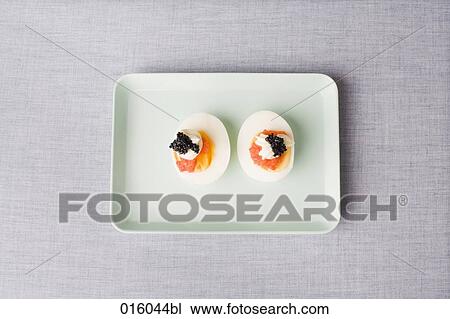 still life of boiled egg cut in half on plate View Large Photo Image Stock Image - still life of boiled egg cut in half on plate. Fotosearch