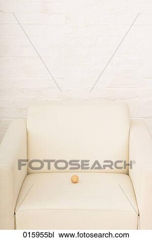 still life of brown egg on white arm chair View Large Photo Image Stock Image - still life of brown egg on white arm chair. Fotosearch