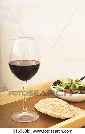 still life of glass with red wine bread and salad on tray View Large Photo Image Stock Image - still life of glass with red wine bread and salad on tray. Fotosearch