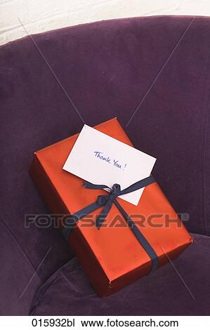 still life of of present with english note thank you on arm chair View Large Photo Image Stock Image - still life of of present with english note thank you on arm chair. Fotosearch
