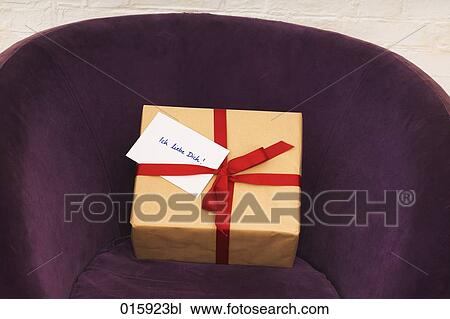 still life of present with german note ich liebe dich on purple arm chair View Large Photo Image Stock Image - still life of present with german note ich liebe dich on purple arm chair. Fotosearch