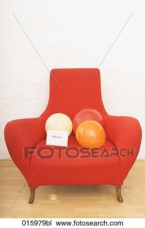 still life of three colourful balloons and german note alles gute on red arm chair View Large Photo Image Stock Image - still life of three colourful balloons and german note alles gute on red arm chair. Fotosearch