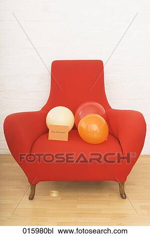 still life of three colourful balloons and french note bonne anniversaire on red arm chair View Large Photo Image Stock Image - still life of three colourful balloons and french note bonne anniversaire on red arm chair. Fotosearch