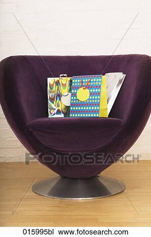 still life of three colourful shopping bags on purple arm chair View Large Photo Image Stock Image - still life of three colourful shopping bags on purple arm chair. Fotosearch