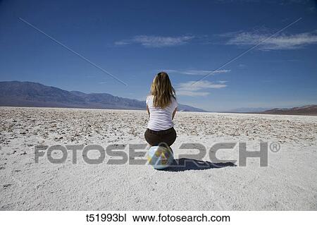 USA, California, Death Valley National Park, woman sitting on globe View Large Photo Image Stock Image - USA, California, Death Valley National Park, woman sitting on globe . Fotosearch