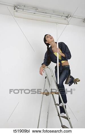 Woman Standing On Ladder View Large Photo Image Stock Image - Woman Standing On Ladder . Fotosearch
