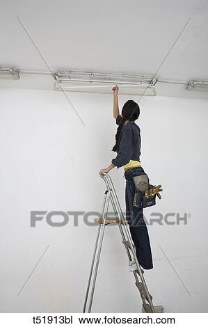 Woman Standing On Ladder View Large Photo Image Stock Image - Woman Standing On Ladder . Fotosearch