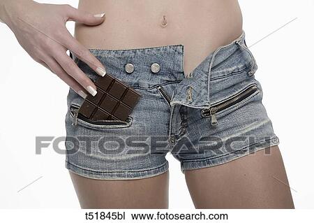 Woman with a chunk of chocolate in pocket View Large Photo Image Stock Image - Woman with a chunk of chocolate in pocket . Fotosearch