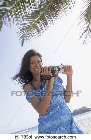 Woman with video camera View Large Photo Image Stock Image - Woman with video camera . Fotosearch