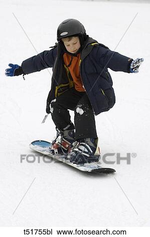 Young boy snowboarder View Large Photo Image Stock Image - Young boy snowboarder . Fotosearch