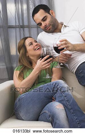 young couple drinking red wine together View Large Photo Image Stock Image - young couple drinking red wine together. Fotosearch