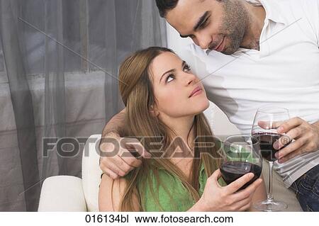 young couple drinking red wine together View Large Photo Image Stock Image - young couple drinking red wine together. Fotosearch