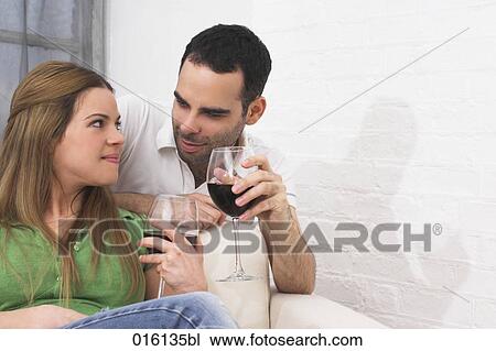 young couple drinking red wine together View Large Photo Image Stock Image - young couple drinking red wine together. Fotosearch