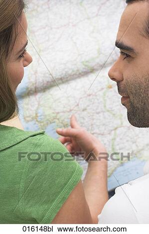 young couple looking at roadmap to plan their holiday View Large Photo Image Stock Image - young couple looking at roadmap to plan their holiday. Fotosearch