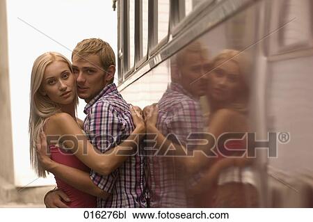 young couple standing at bus embracing View Large Photo Image Stock Image - young couple standing at bus embracing. Fotosearch