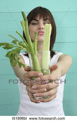 Young woman and celery View Large Photo Image Stock Image - Young woman and celery . Fotosearch