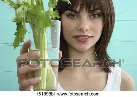 Young woman and celery View Large Photo Image Stock Image - Young woman and celery . Fotosearch