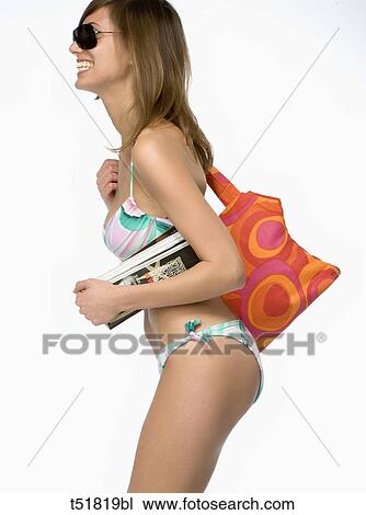 Young woman with beach gear View Large Photo Image Stock Image - Young woman with beach gear . Fotosearch