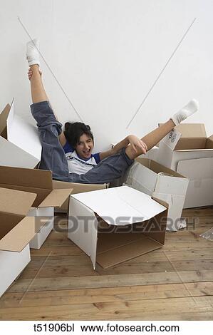 Young woman with paper boxes View Large Photo Image Stock Image - Young woman with paper boxes . Fotosearch
