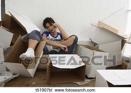 Young woman with paper boxes View Large Photo Image Stock Image - Young woman with paper boxes . Fotosearch