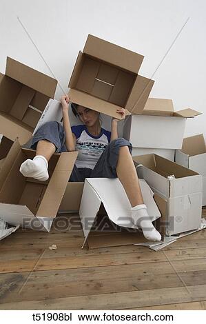 Young woman with paper boxes View Large Photo Image Stock Image - Young woman with paper boxes . Fotosearch