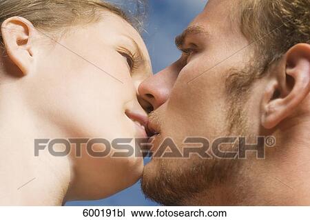 close-up of young couple kissing View Large Photo Image Stock Image - close-up of young couple kissing. Fotosearch